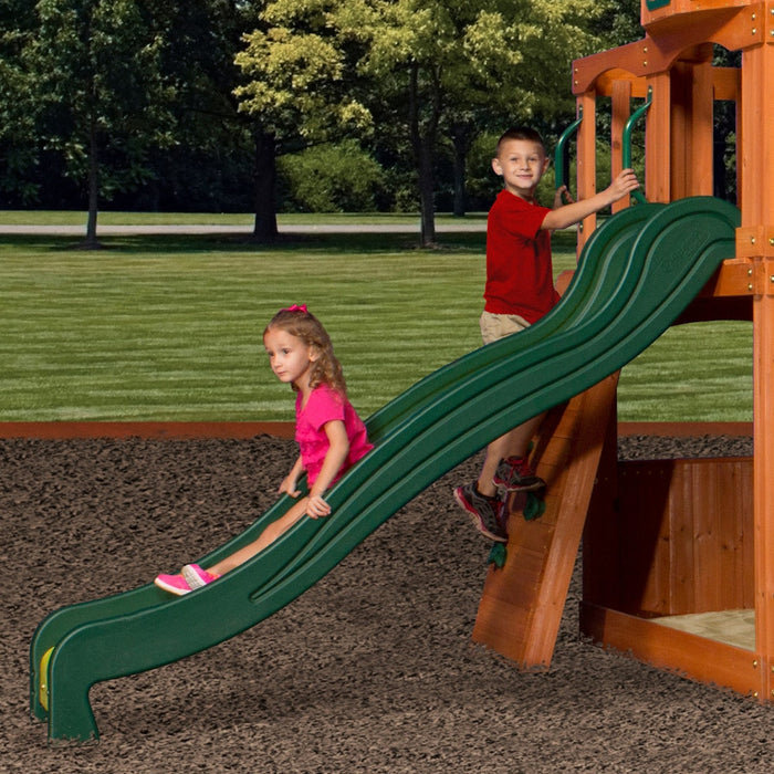 Close up image of 2 children climbing the rock climbing wall and sliding on the slide of the Backyard Discovery Atlantis Play Centre Swing And Play Set