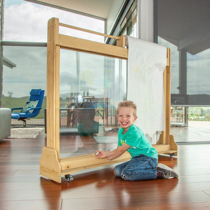 Angle view image of Creativ Drawing Board with little boy smiling in front of the drawing board in living room background