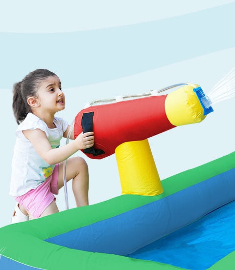 Crocadoo Slide And Splash - toddler using the water gun
