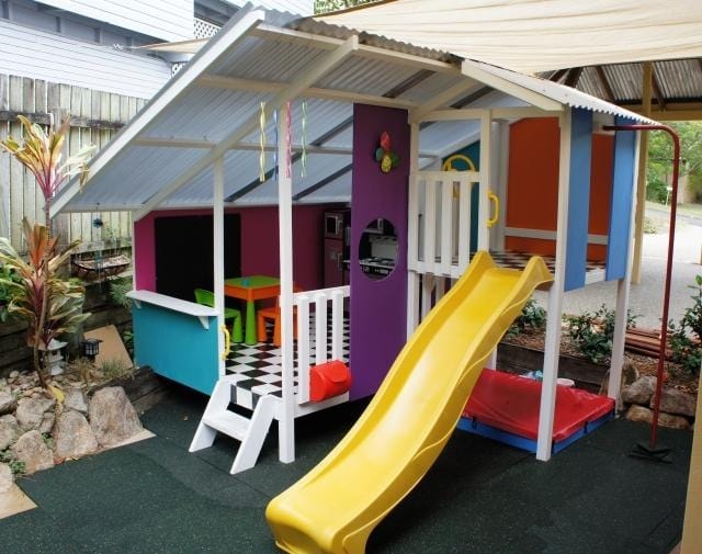 Mega Triplex Cubby House - painted in all different colours with yellow slide and sandpit