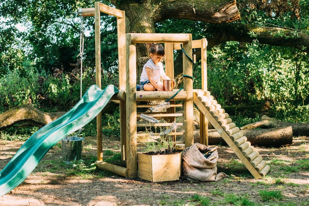 Woodland Treehouse - little girl playing in the treehouse