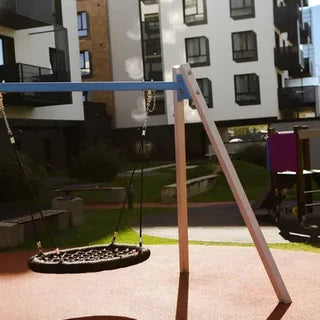 Wooden swing set installed and anchored in an Australian backyard