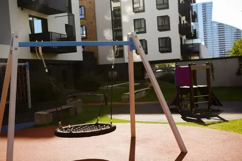 Wooden swing set installed and anchored in an Australian backyard
