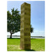 close up image of the 127 cm giant jenga on grass with a pond in the background