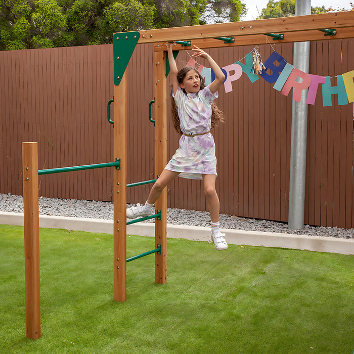 Coburg Lake Wooden Playground set with monkey bars and a happy birthday banner