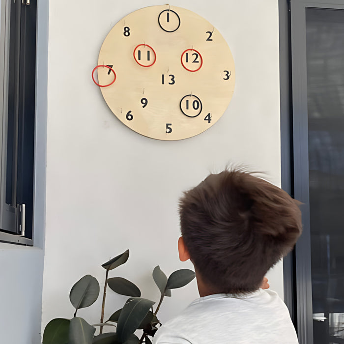 a boy playing with the hookey board outside on a wall