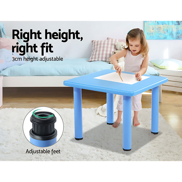 a child with the blue table standing and drawing with text explaining it is the right height for a child