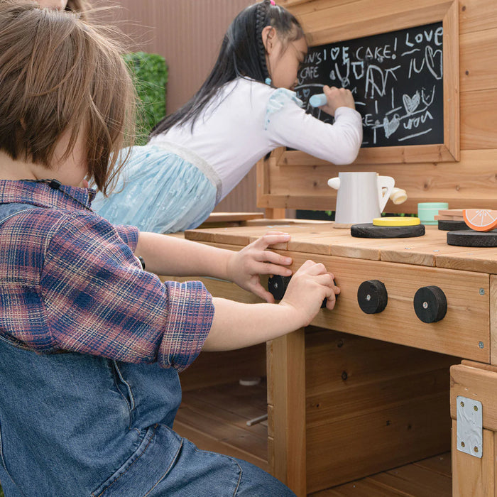 Child playing at the Lifespan Kids Eden mud kitchen