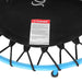 Black trampoline with a warning label on a white background