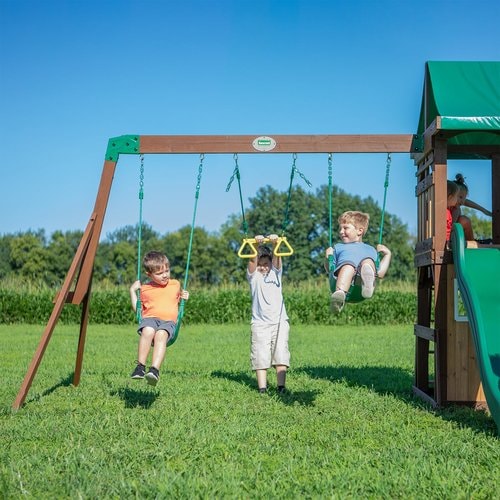 Image of 2 little boys swinging on the swings and a little boy swinging on the trapeze of Lakewood Swing And Play Set