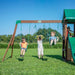 Image of 2 little boys swinging on the swings and a little boy swinging on the trapeze of Lakewood Swing And Play Set