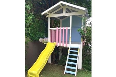 Medium Fort Cubby House - painted in white with pink  and blue accent (comes w/ yellow slide