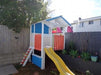 Medium Fort Cubby House - painted in white, orange and blue with yellow slide