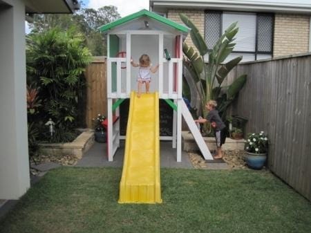 Small Fort Cubby House - painted in white with yellow slide