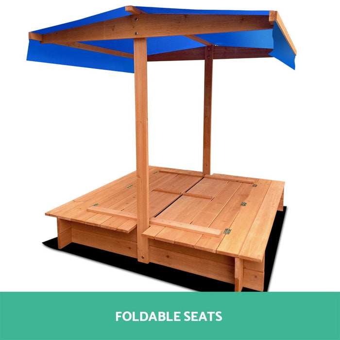 blue canopy sandpit with seats and cover, it has a white background and has a blue shade seats are down and covering the sand