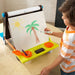 Kids Tabletop Easel - little boy draw sun and tree