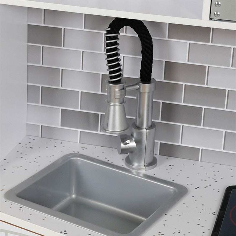 Close up image of the faucet and sink of Victoria Kids Kitchen in White