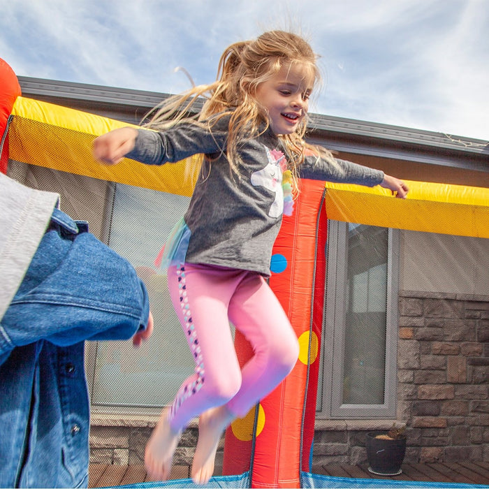 Close up image of a little girl jumping on the AirZone 8 12ft Jumping Bouncy Castle