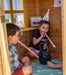 Close up image of 2 little kids playing inside the Archie Cubby House with slide