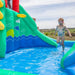 Image of a little girl playing in the Atlantis Inflatable Pool Water Slide filled with water