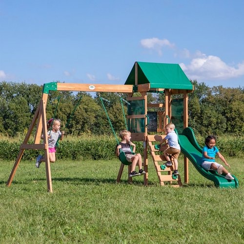 Image of 4 little children playing in the Buckley Hill Play Set in outdoor background