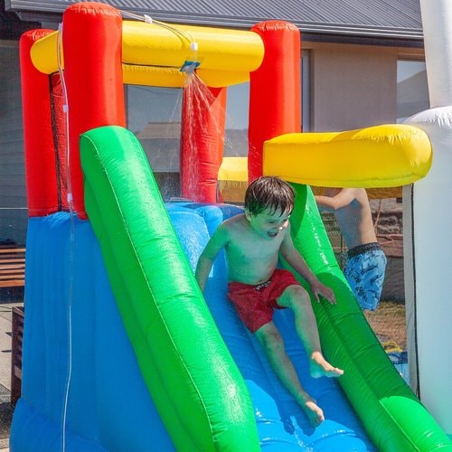 Olympic Sports Water Park - little boy enjoying the slide