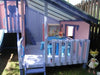 Mega Triplex Cubby House - cute design painted in light blue and light pink; with blue table and chairs