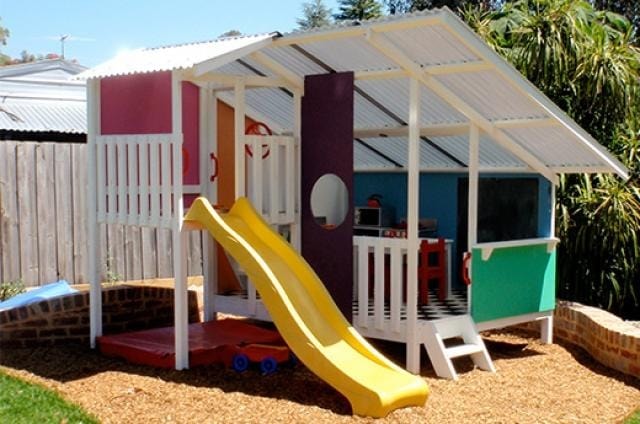 Mega Triplex Cubby House - cute design painted in white with pink, orange, blue green and violet  with yellow slide