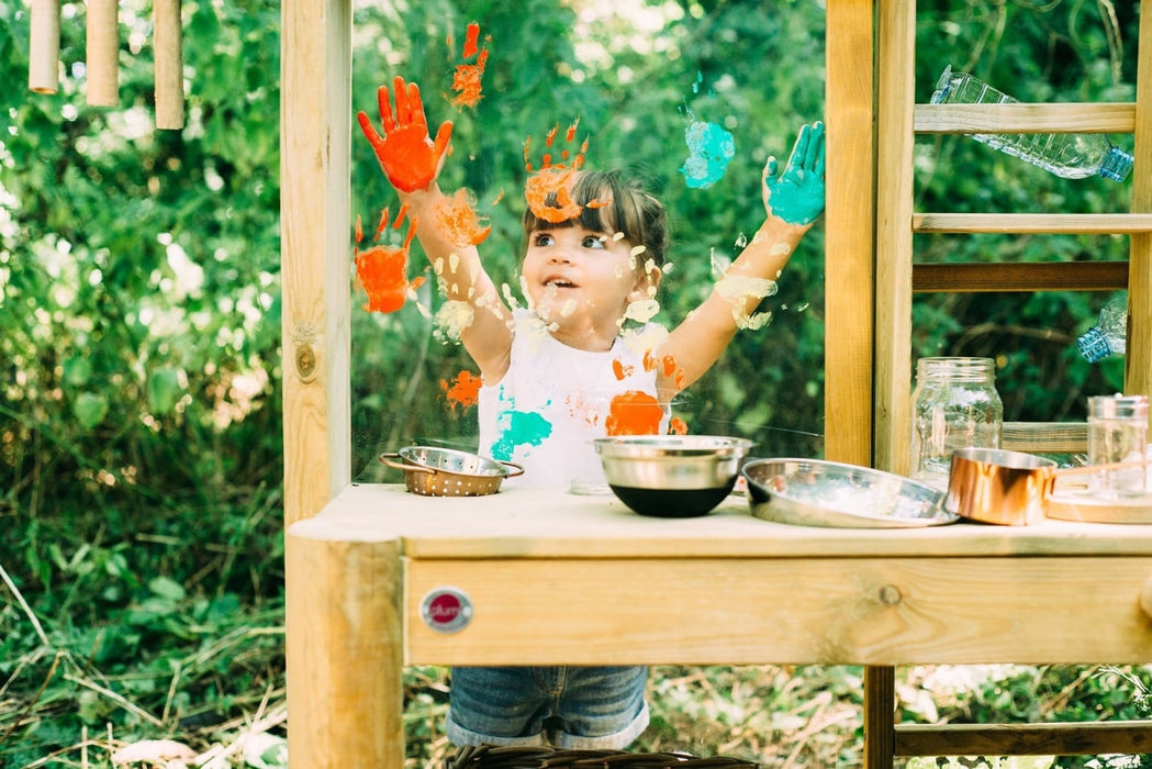 Child using the Plum Discovery Mud Pie kitchen