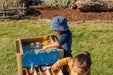 kids playing with the forest water run on some grass