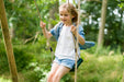 Gibbon Swing Set - little girl swinging