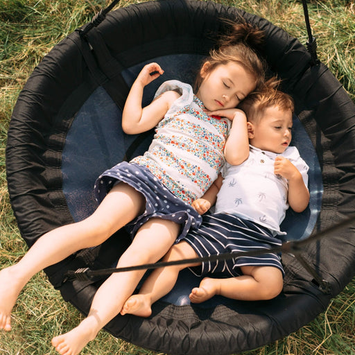 kids sleeping on the Blue Nest Swing with Teal Hangars