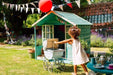 Plum Cubby House in Teal little girl playing
